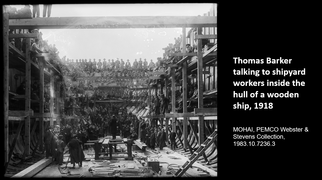 Thomas Barker talking to shipyard workers inside the hull of a wooden ship, 1918   MOHAI, PEMCO Webster & Stevens Collection, 1983.10.7236.3