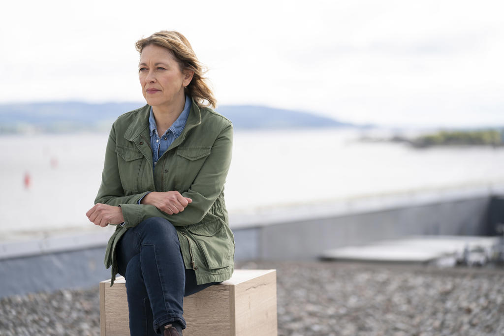 Nicola Walker sitting and staring off into the distance